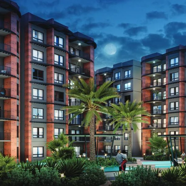 CKPC Winds of Change, Yelahanka Towers around a landscaped courtyard at night, CKPC Winds of Change, developer render